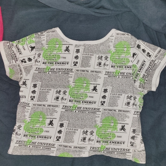 Angel Energy cropped newspaper print shirt with green dragons on it - Picture 2 of 3